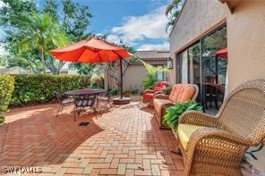 a view of a backyard with sitting area