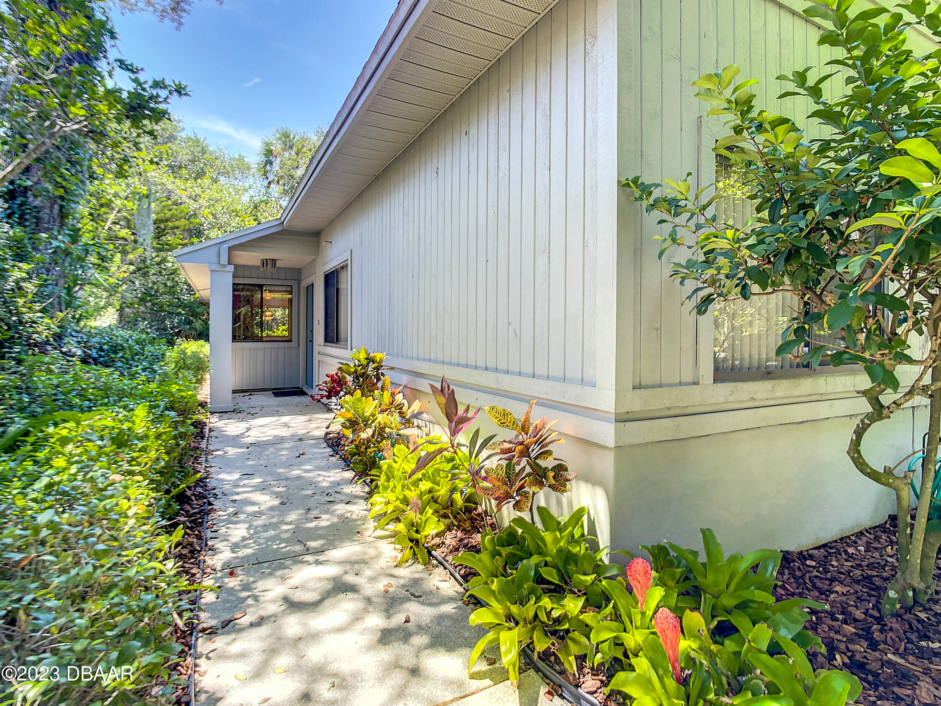 a front view of a house having a yard