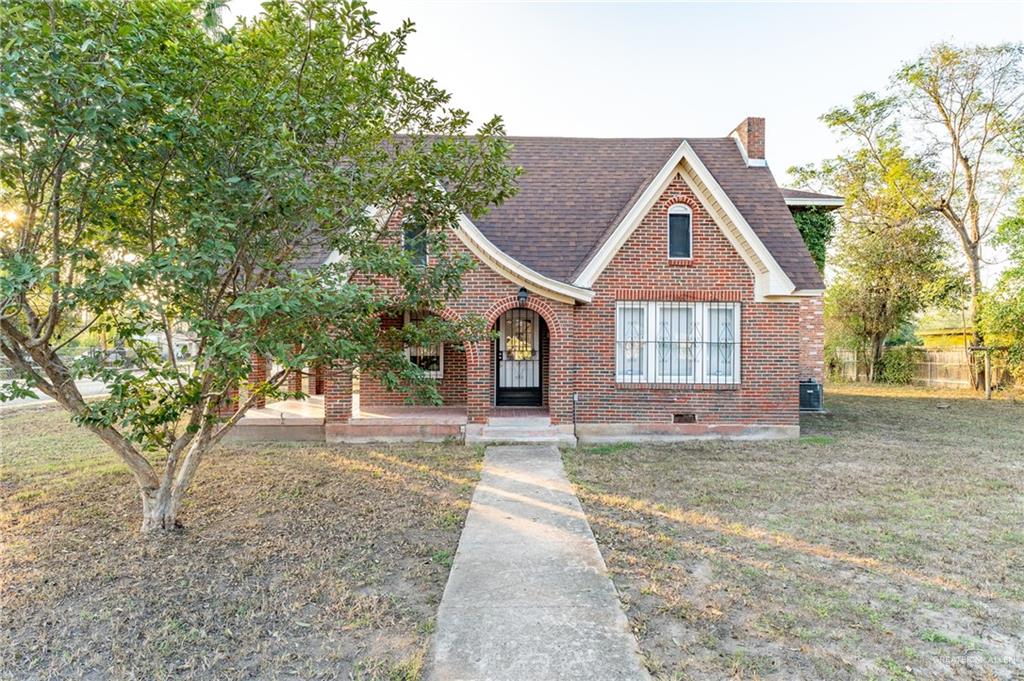 English style home featuring a front yard