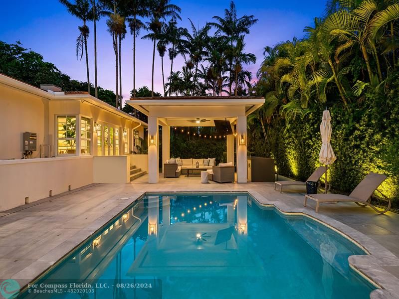 a view of a swimming pool with a patio