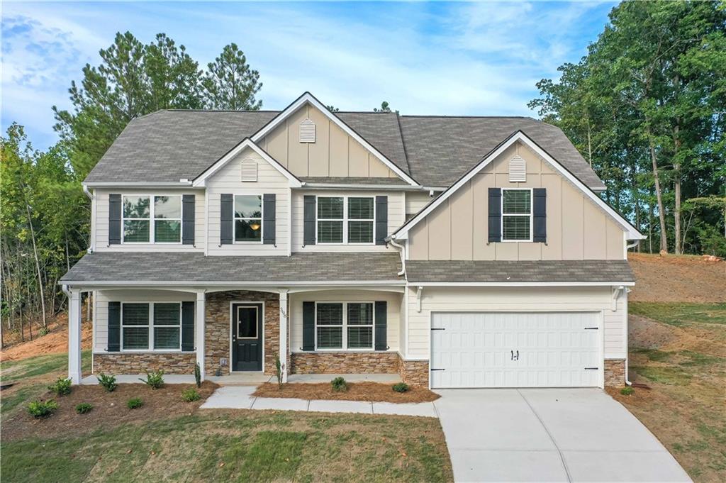 a front view of a house with a yard