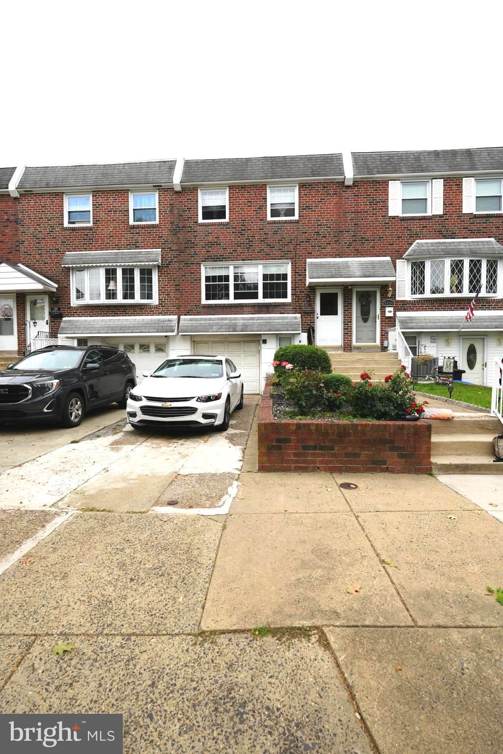 a car parked in front of a brick building