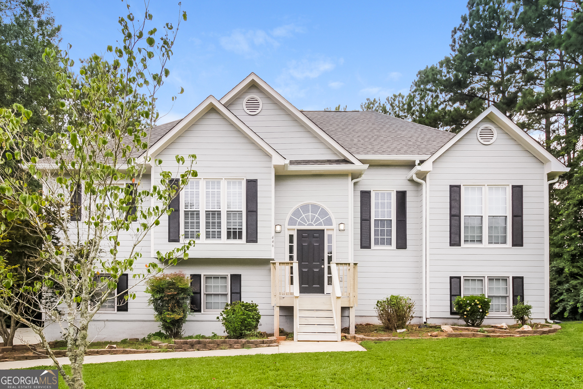 front view of a house with a yard