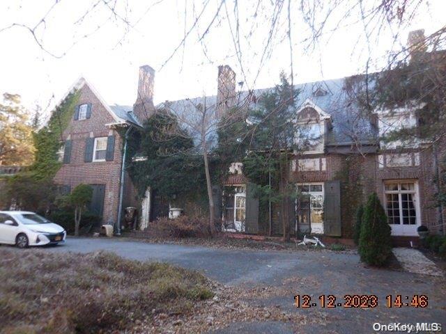 a view of a house with a street