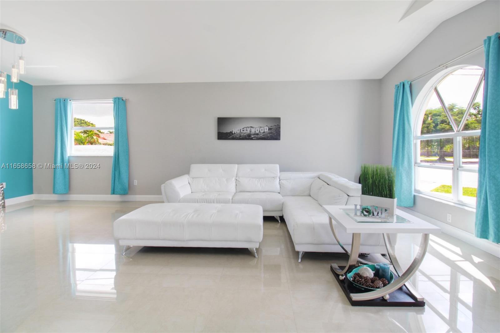 a living room with furniture and a window