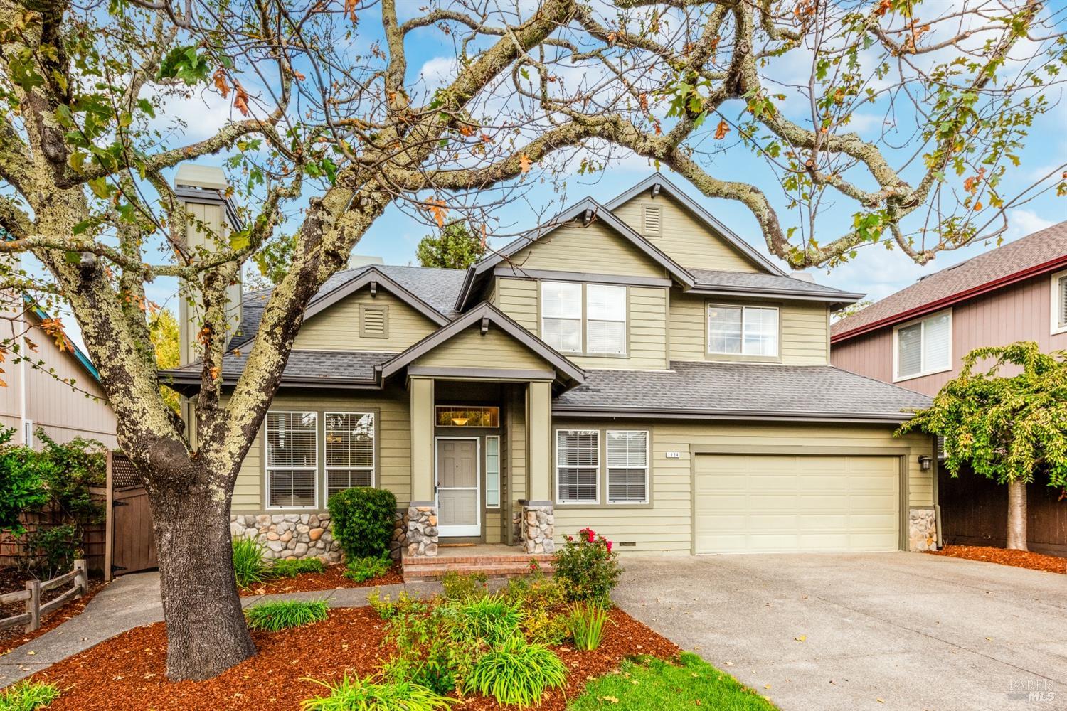 front view of a house with a small yard