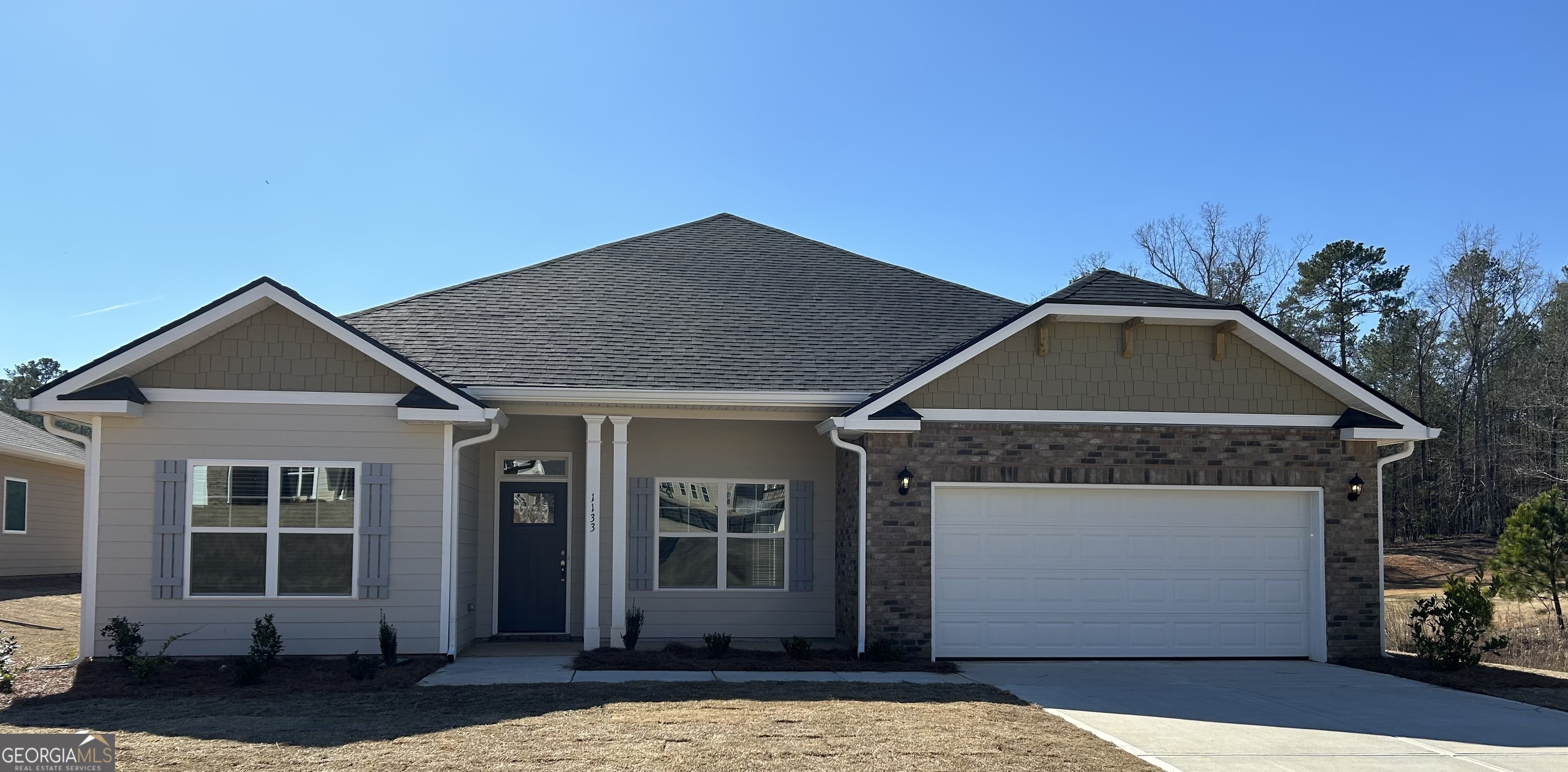 a front view of a house with a yard