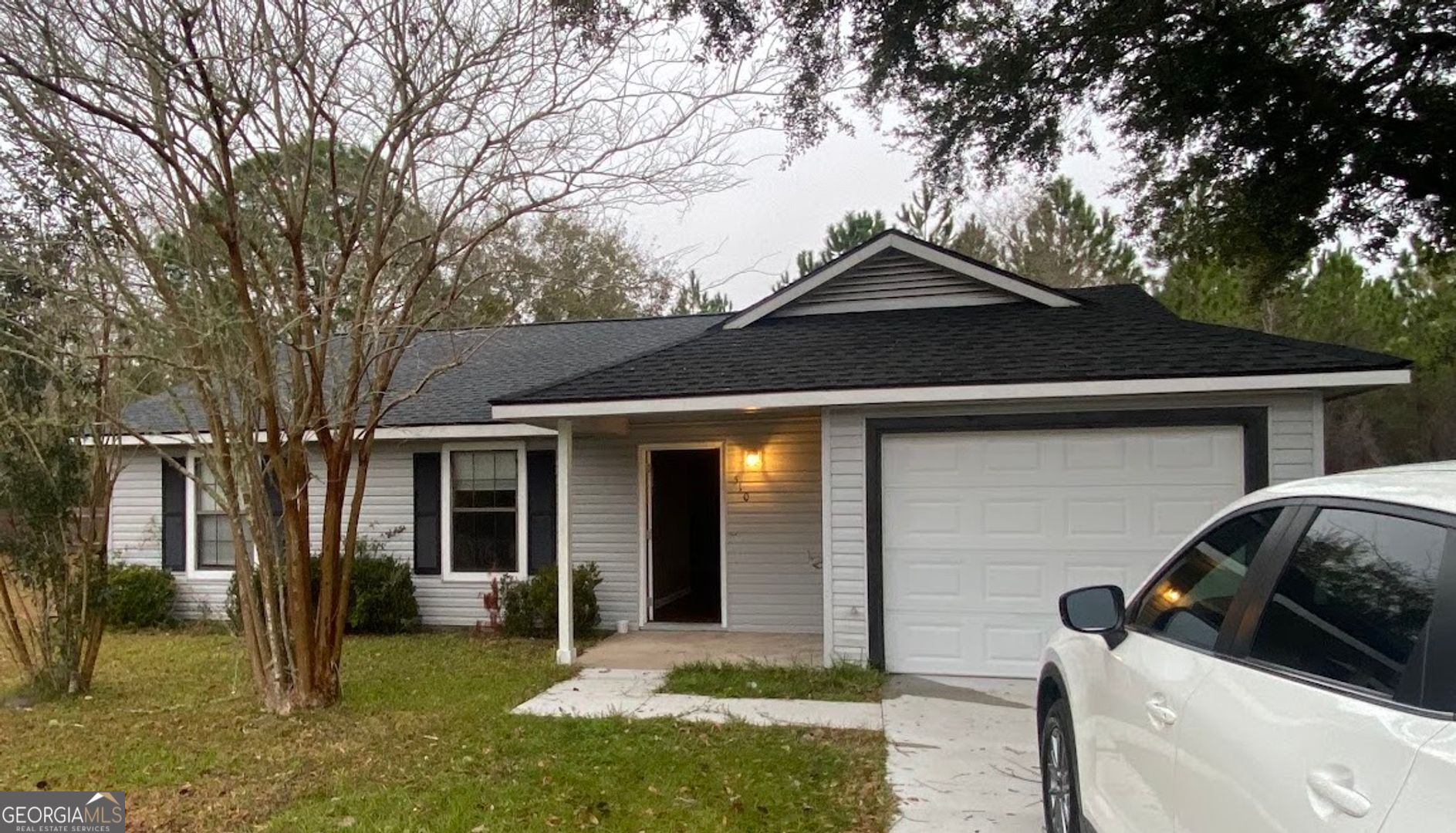 a front view of a house with a yard