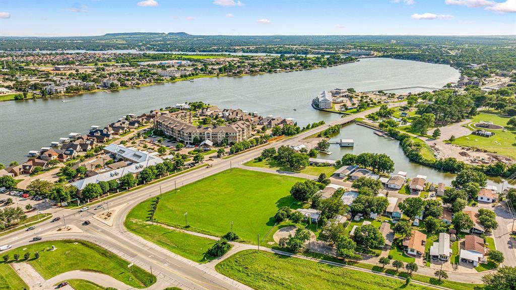 an aerial view of lake residential houses with outdoor space and ocean view