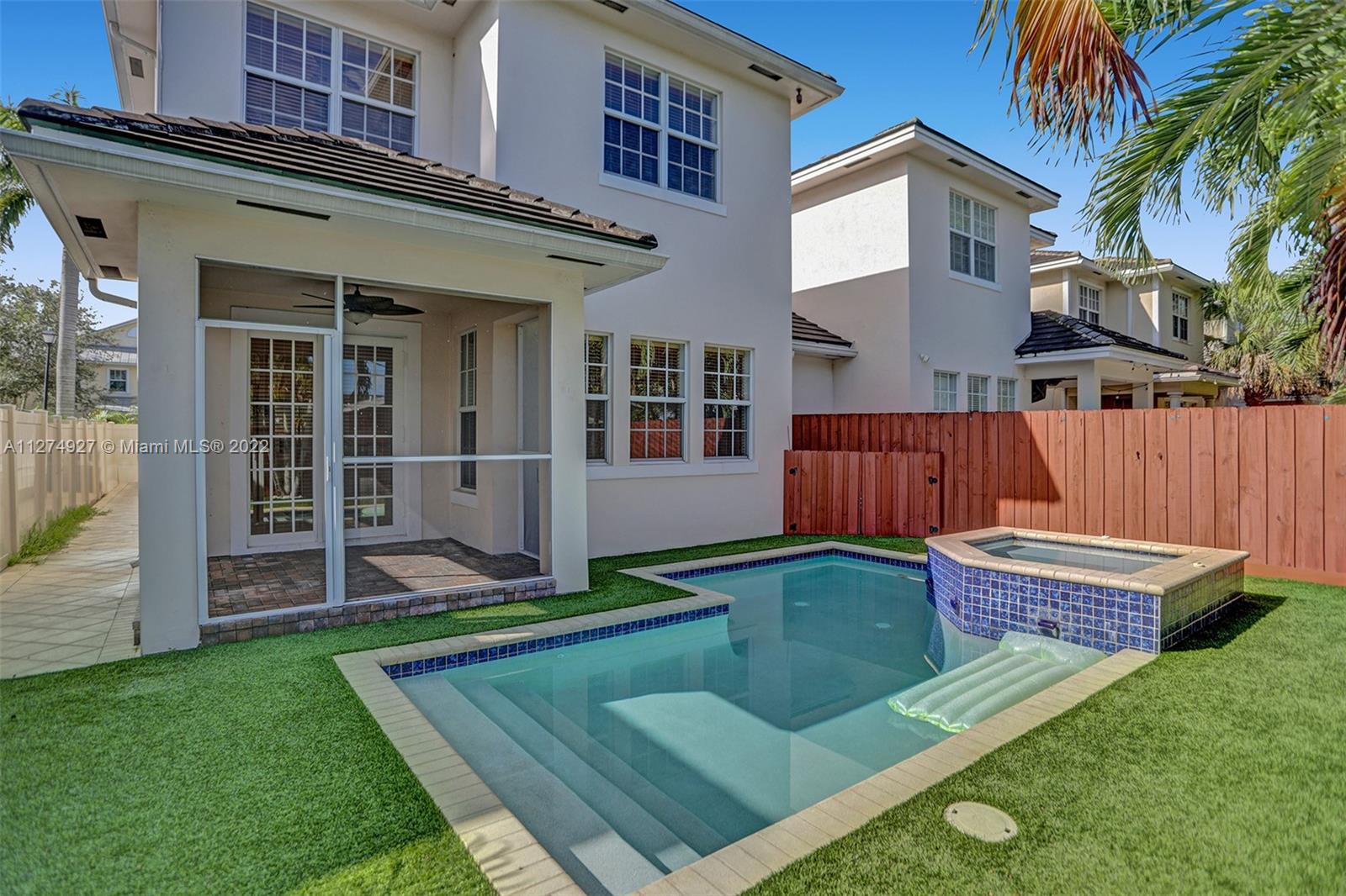 a view of an house with backyard porch and sitting area