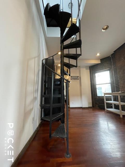 a view of entryway with wooden floor