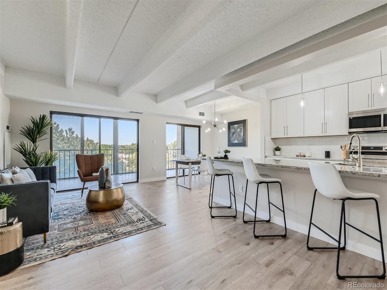 a view of kitchen with dining table and chairs