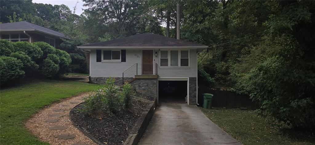 a front view of a house with garden