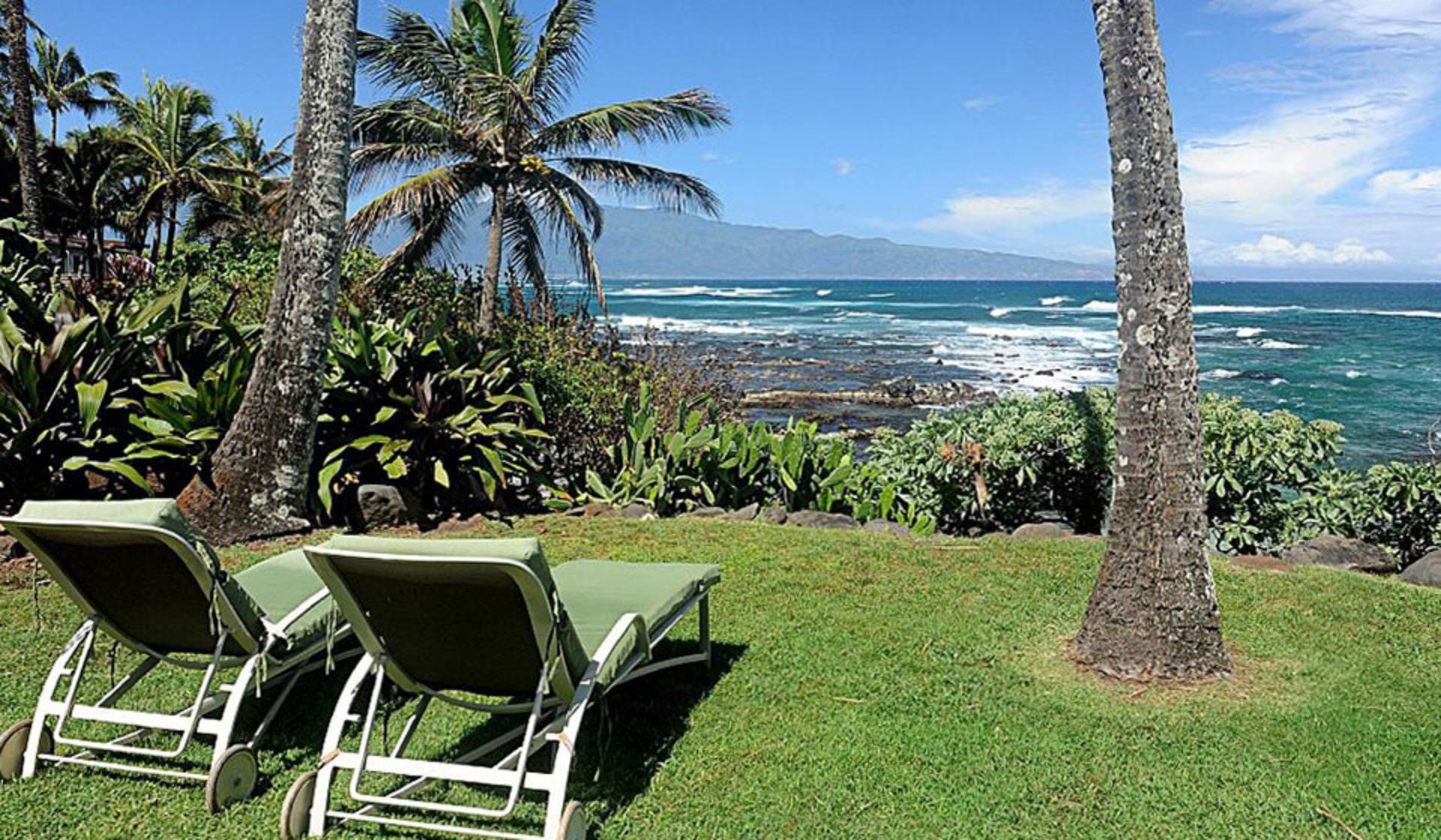 a view of a backyard with sitting area