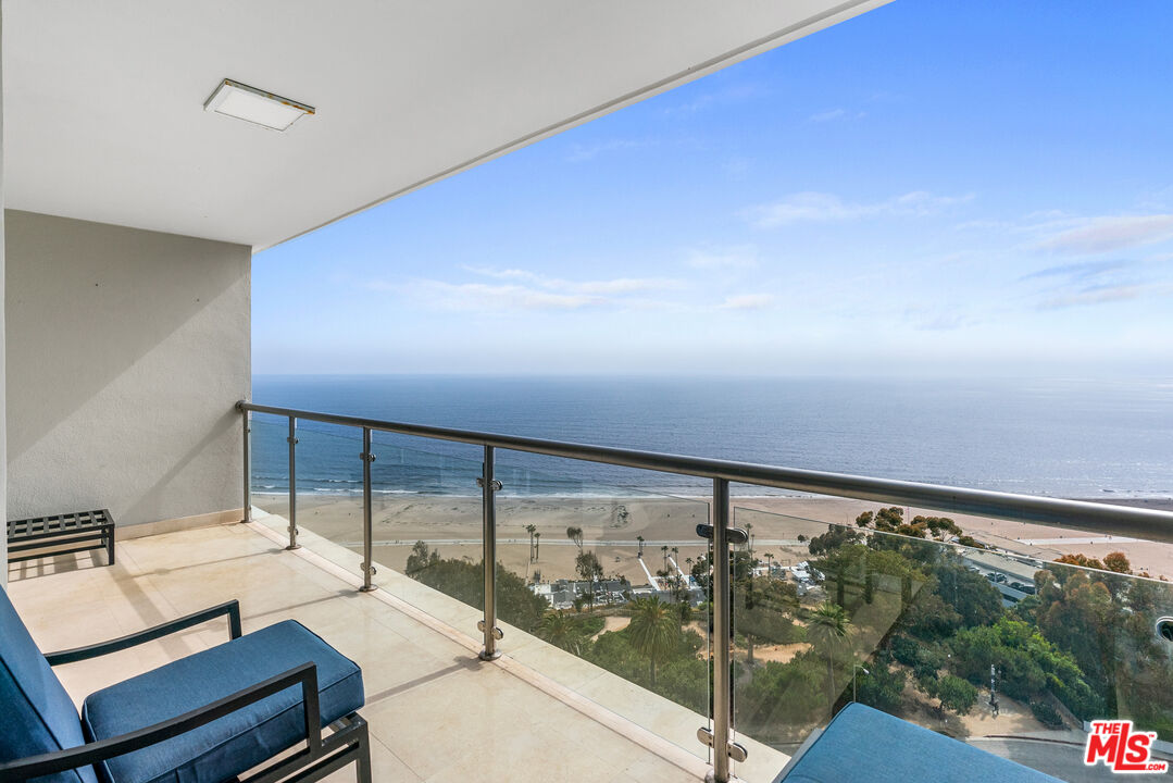 a view of a living room and floor to ceiling window