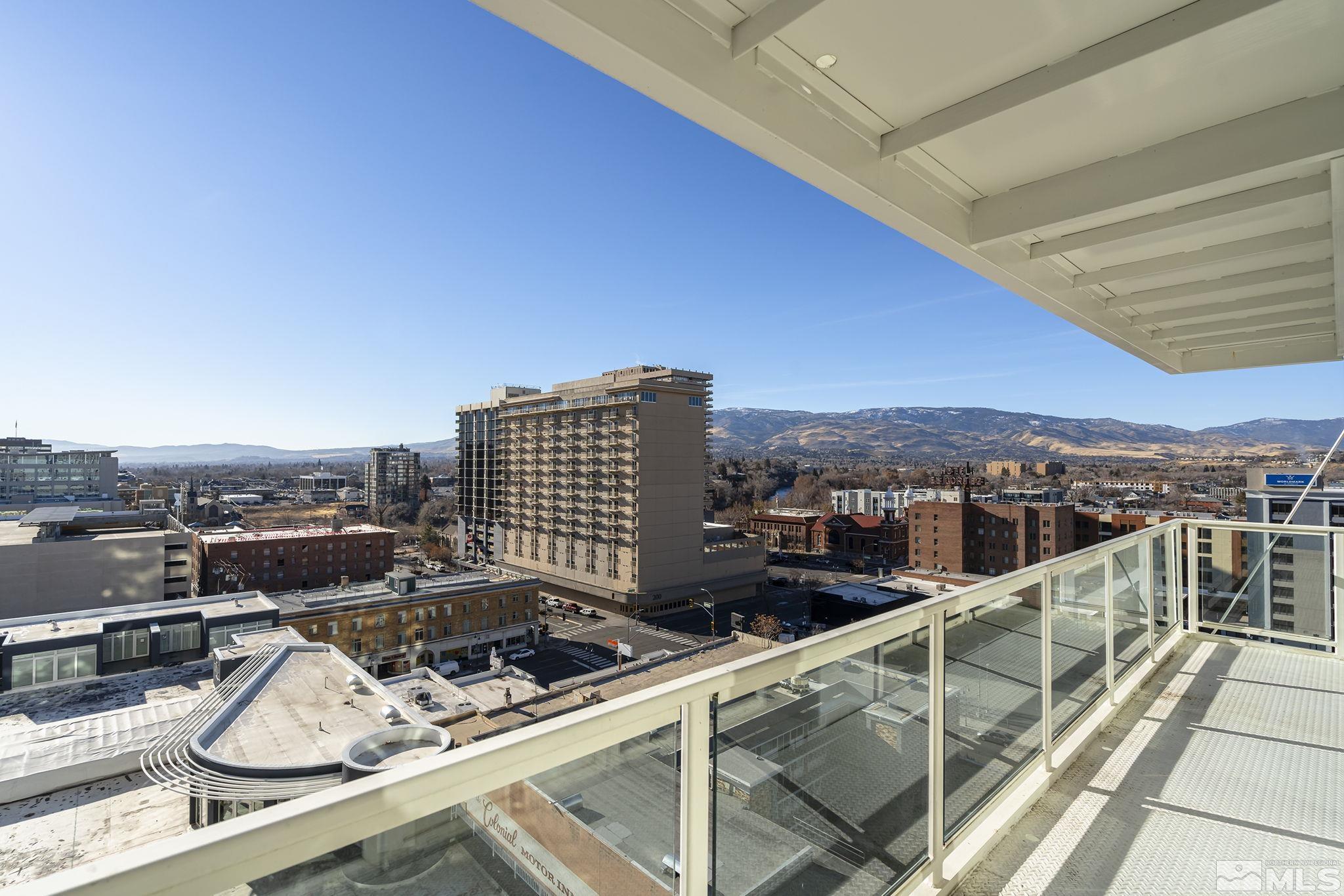 a view of a balcony with city view