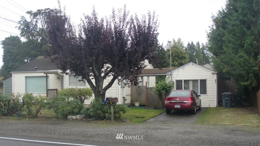 a car parked in front of a house