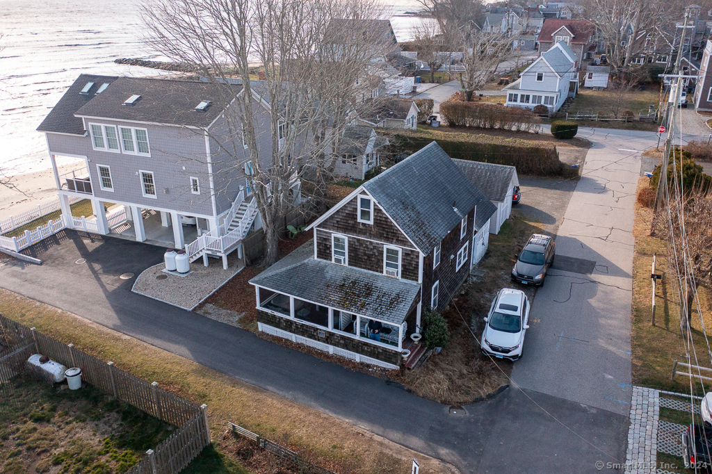 a aerial view of a house with a yard