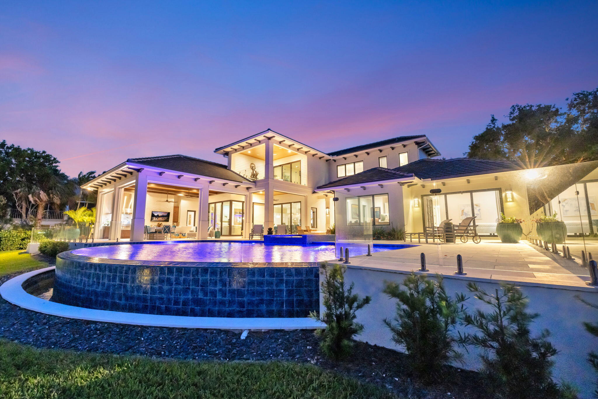 a front view of a house with a yard fountain