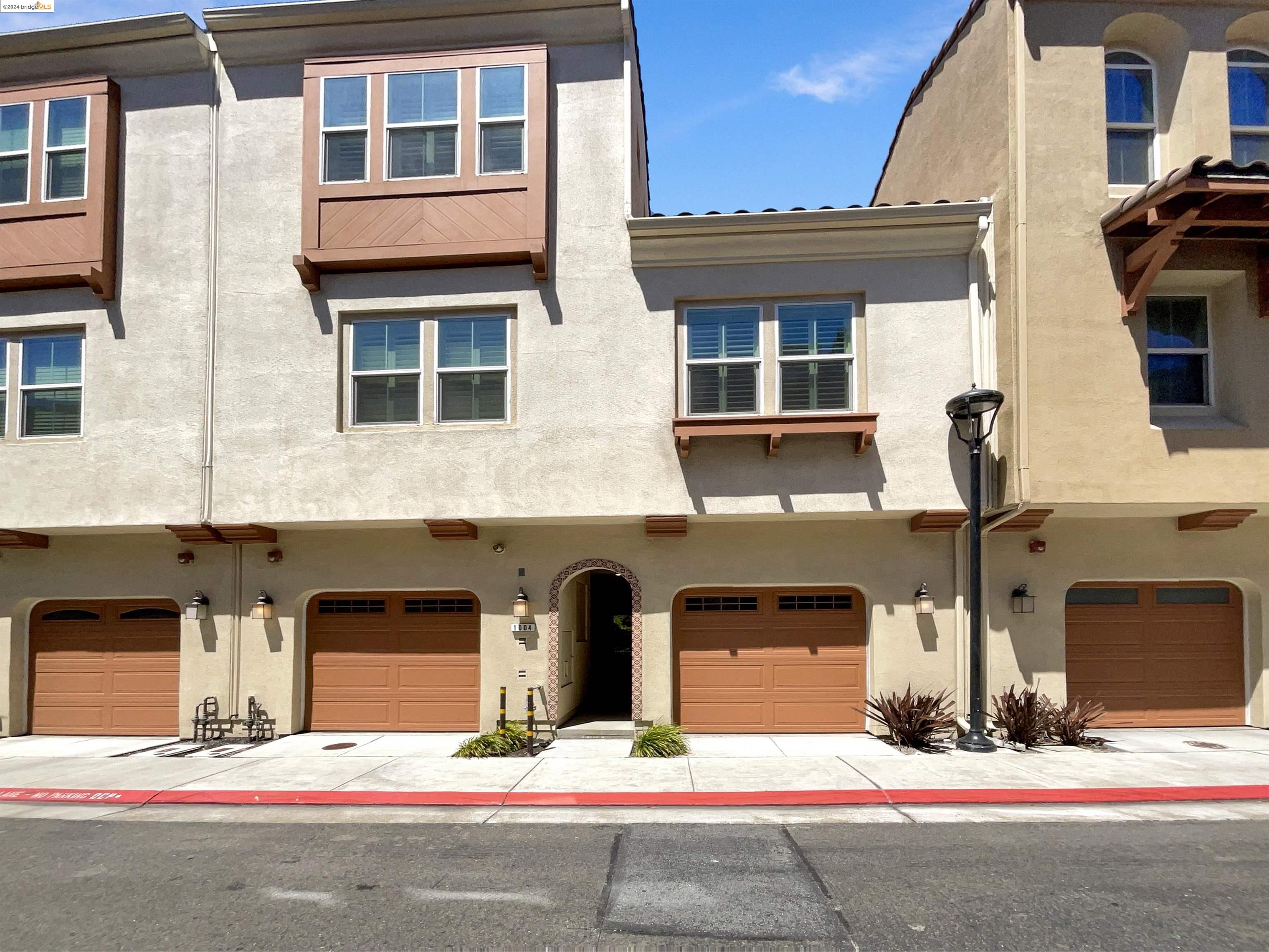 a front view of a house with yard