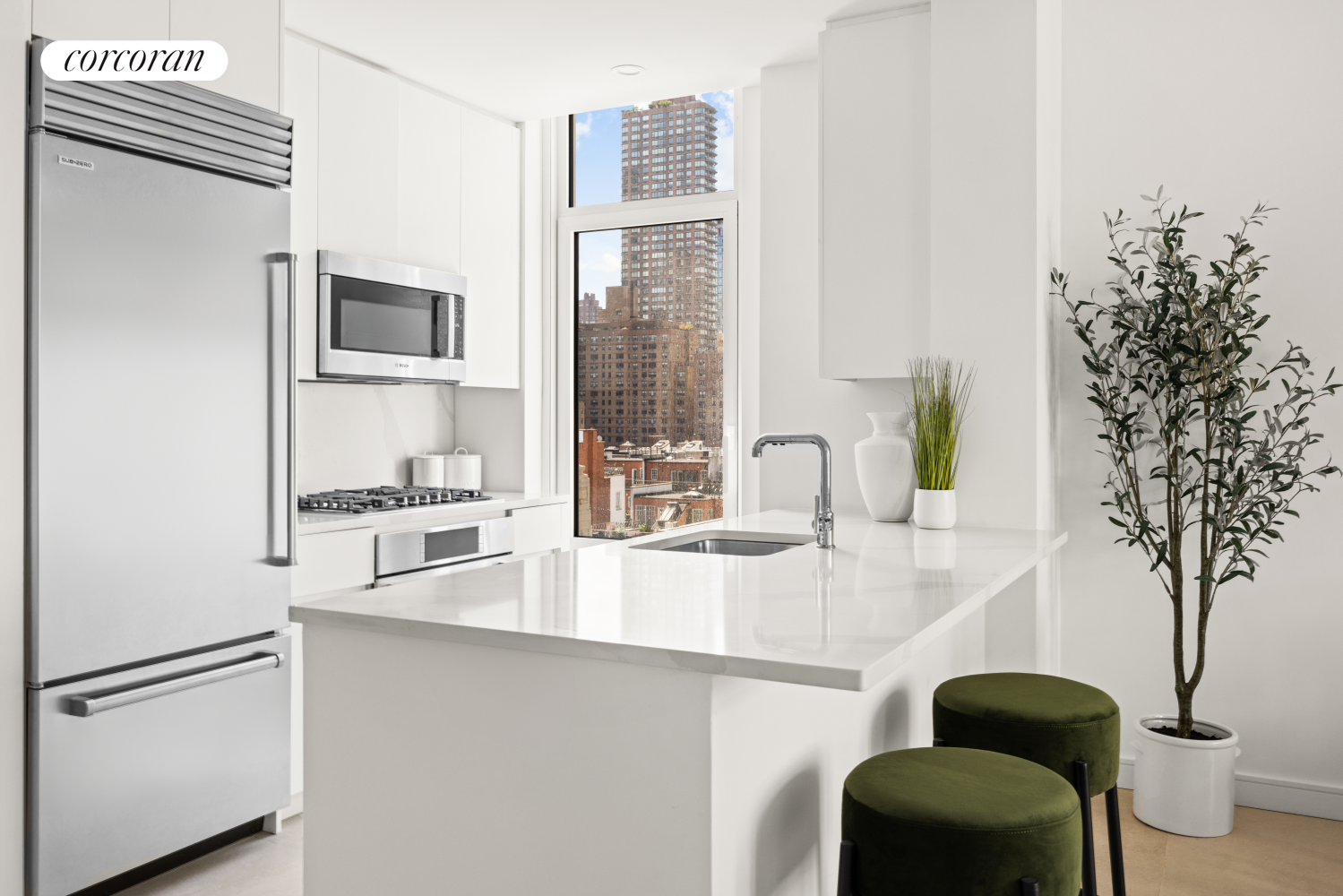 a kitchen with stainless steel appliances granite countertop a refrigerator and a sink