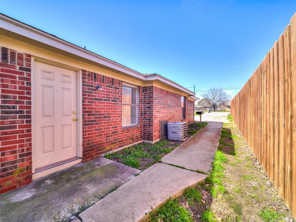 a view of a back yard with a house