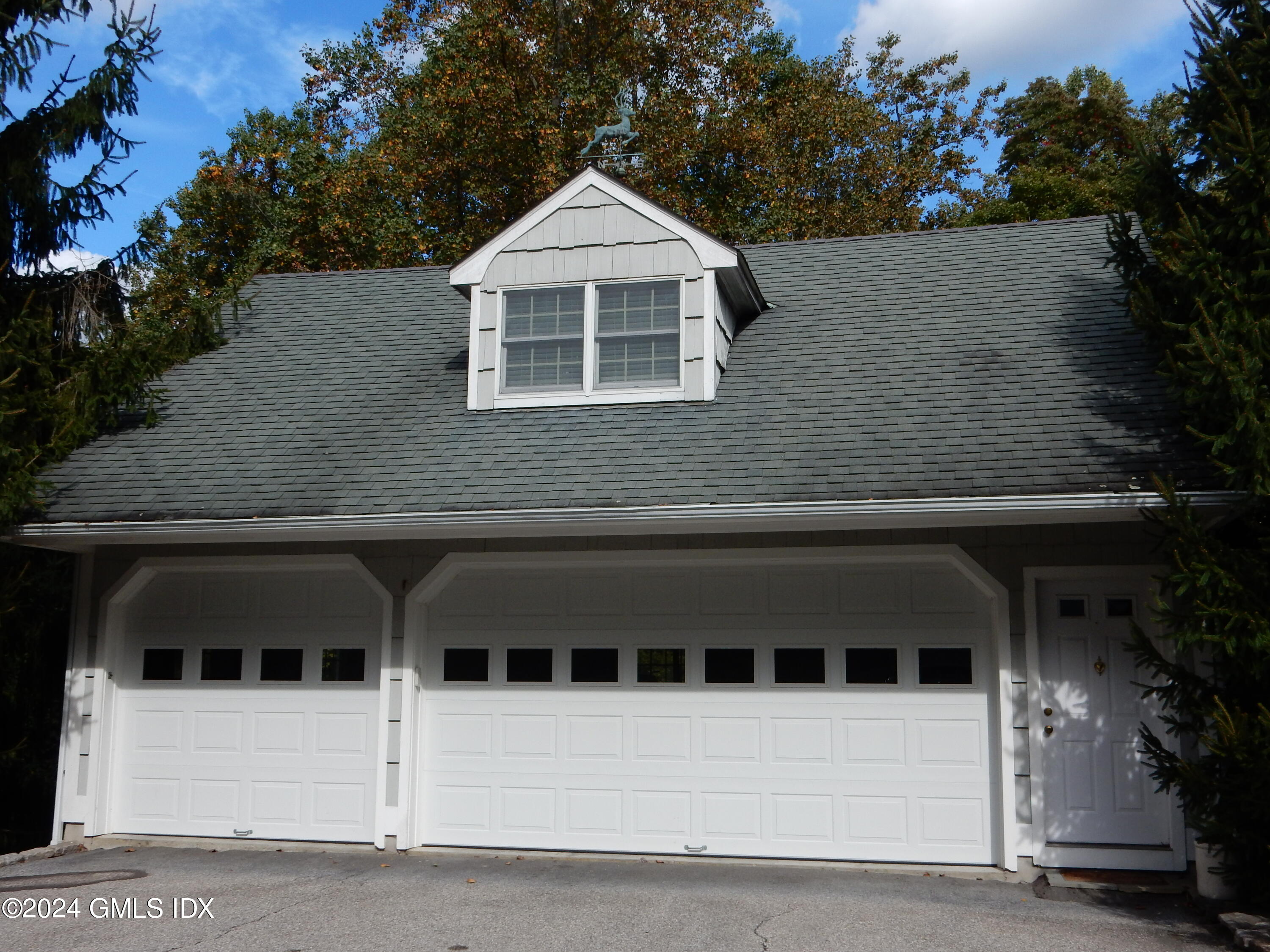 a front view of a house with a garage