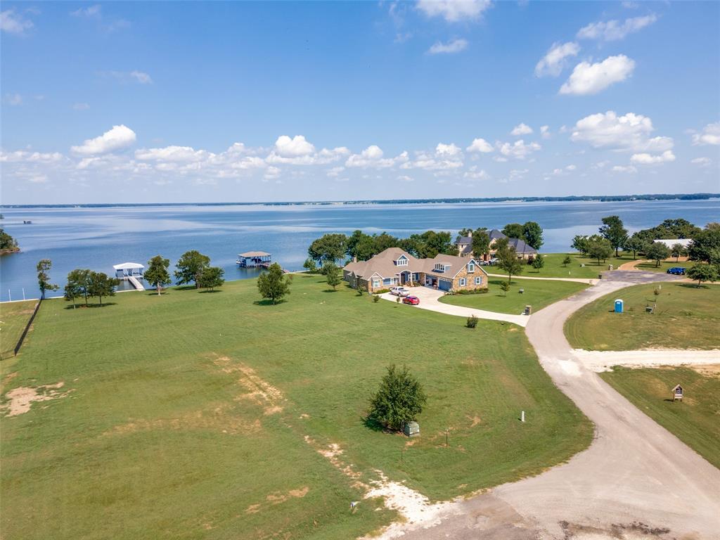 a view of a golf course with an ocean view