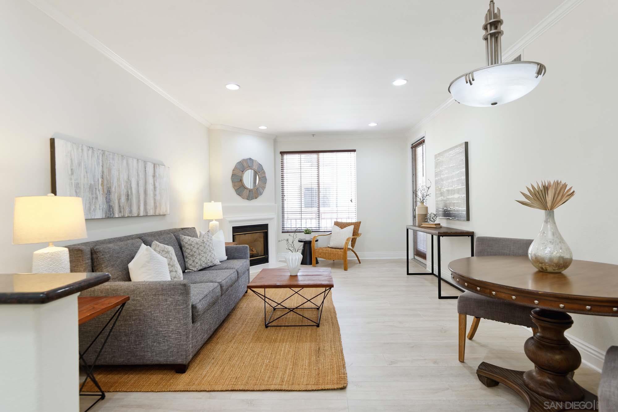 a living room with furniture rug and window