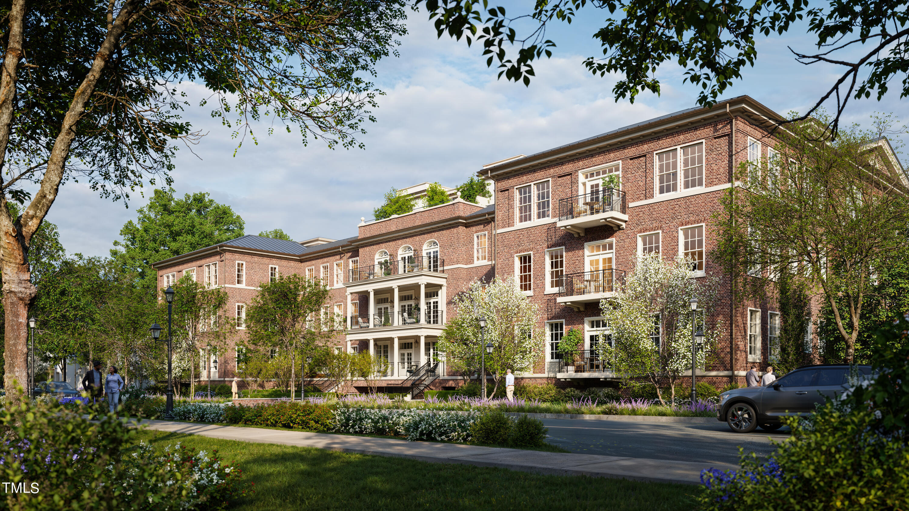 a front view of a residential apartment building with a yard