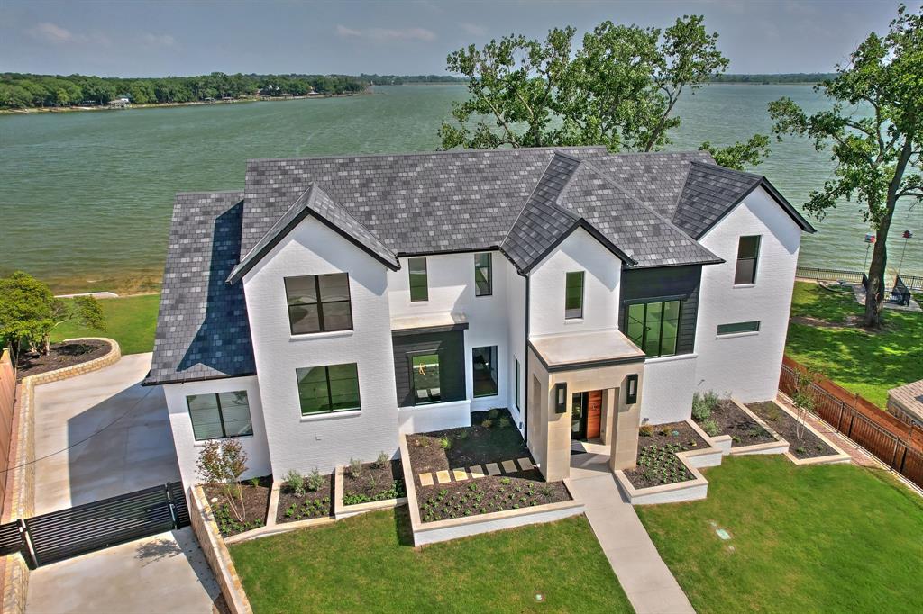 a aerial view of a house with a yard