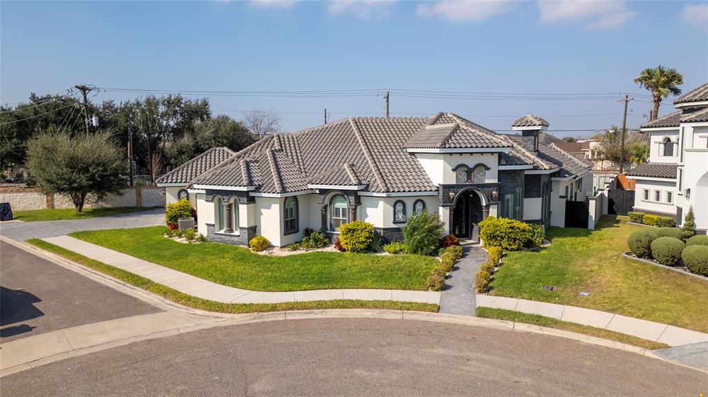 a view of house with garden space and street view