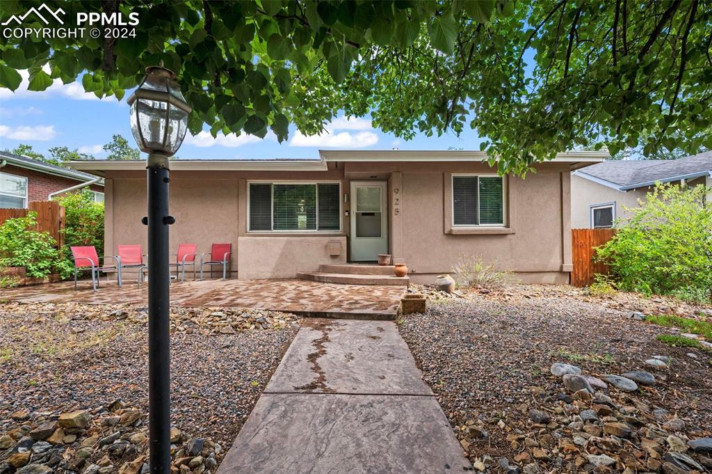 front view of a house with a tree