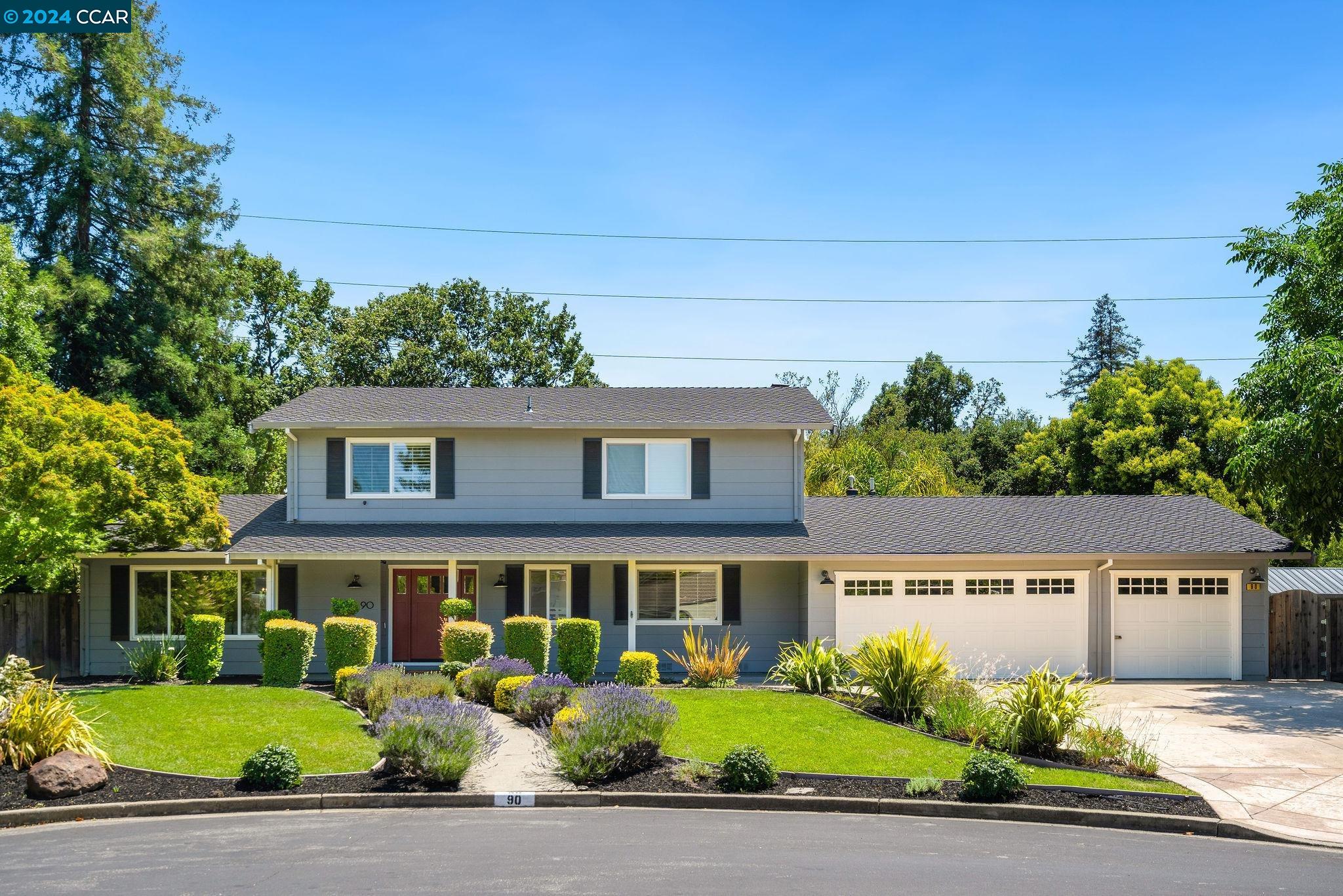 front view of a house with a garden