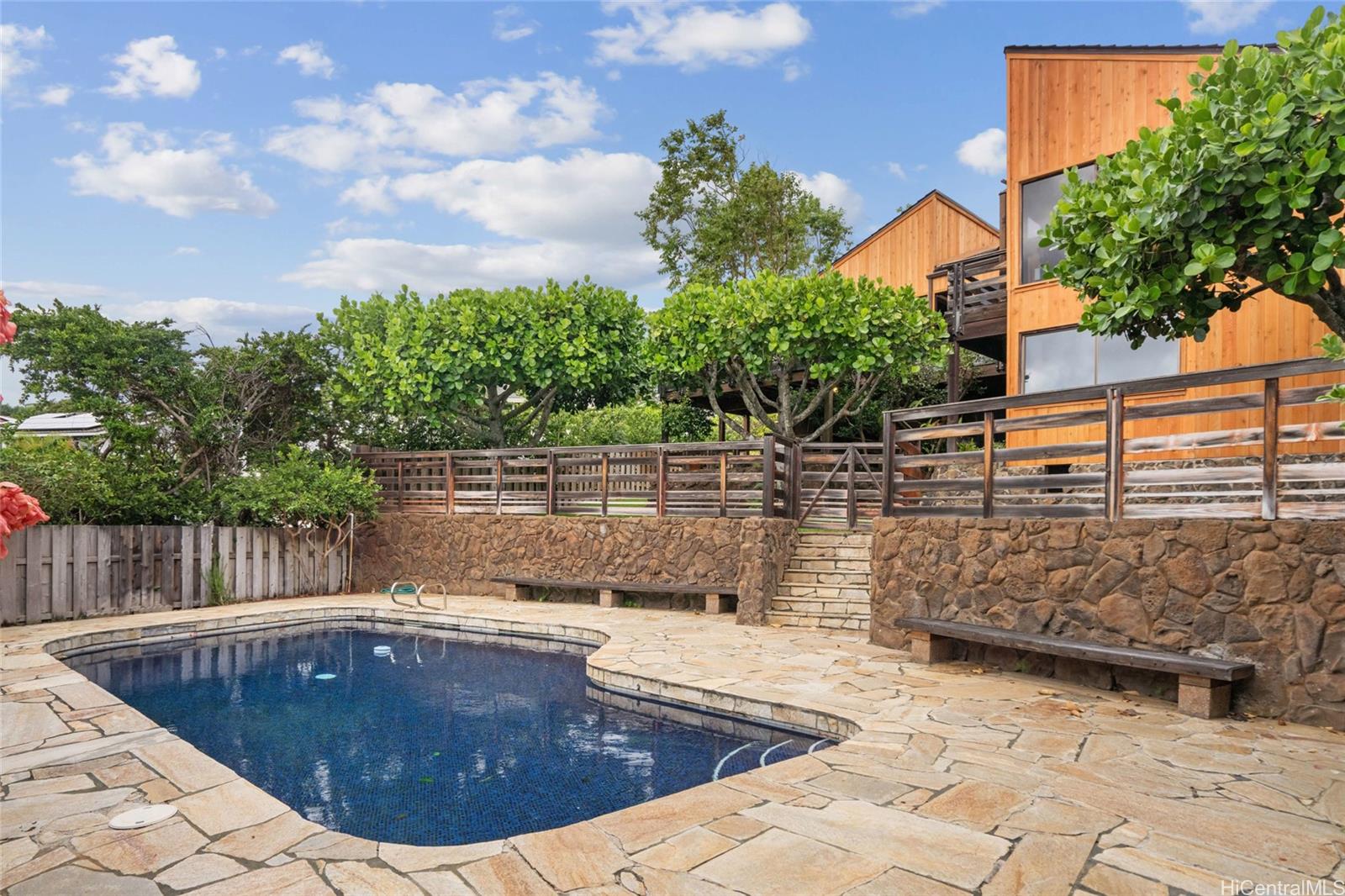 a view of swimming pool with outdoor seating