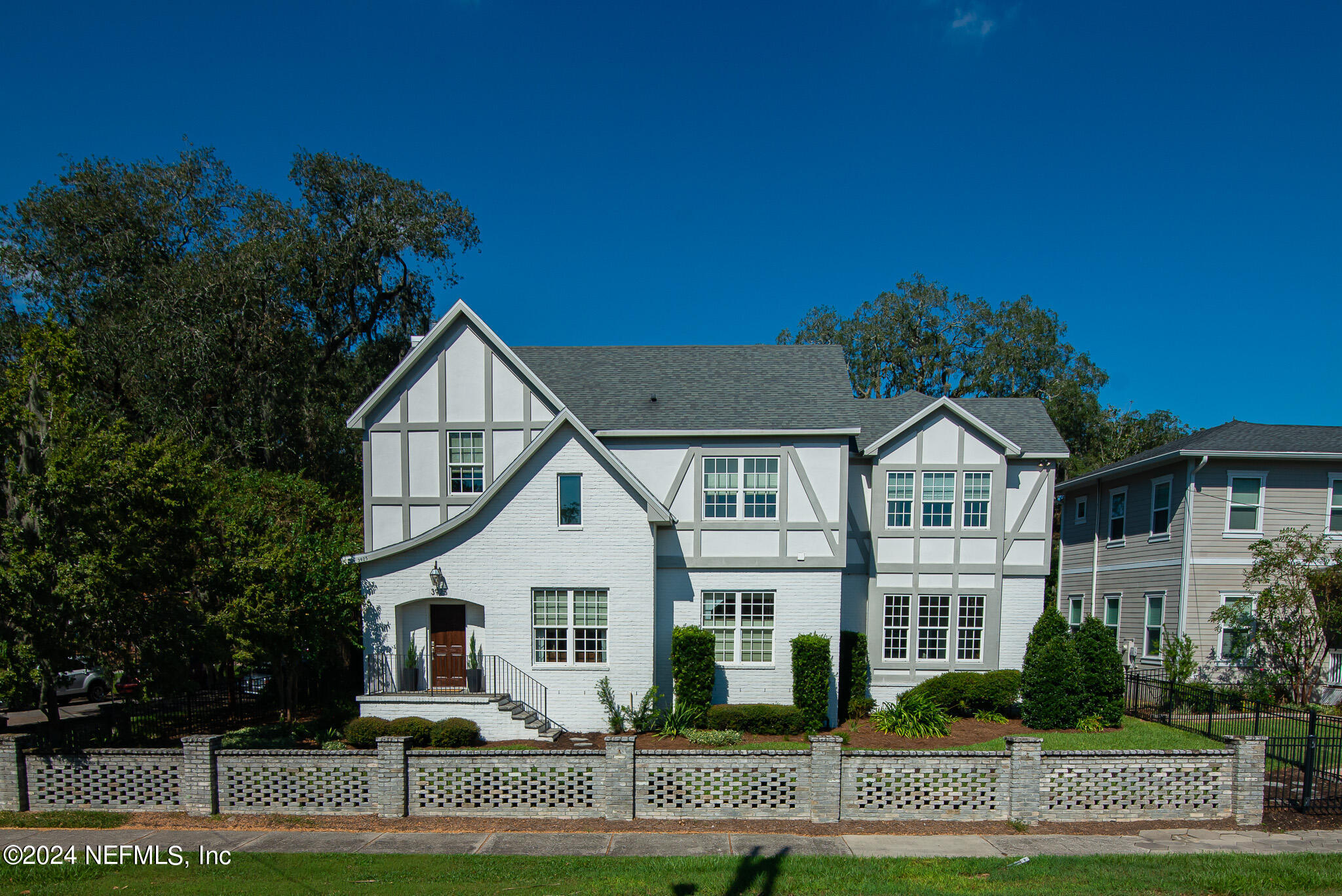 a front view of a house with a yard