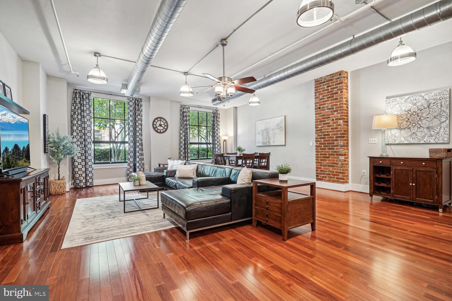 a living room with furniture or fireplace and a wooden floor