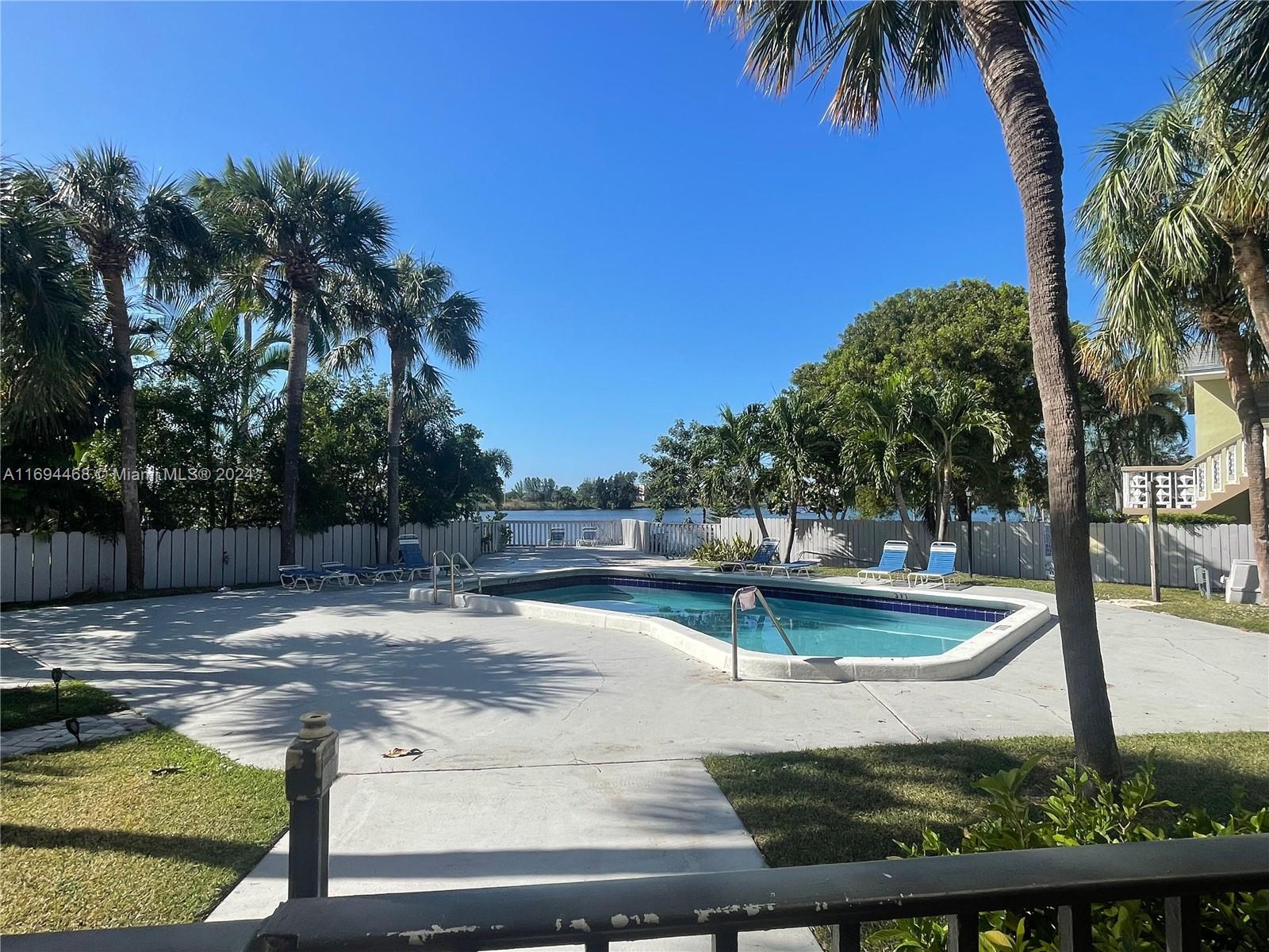 a view of a swimming pool with a patio