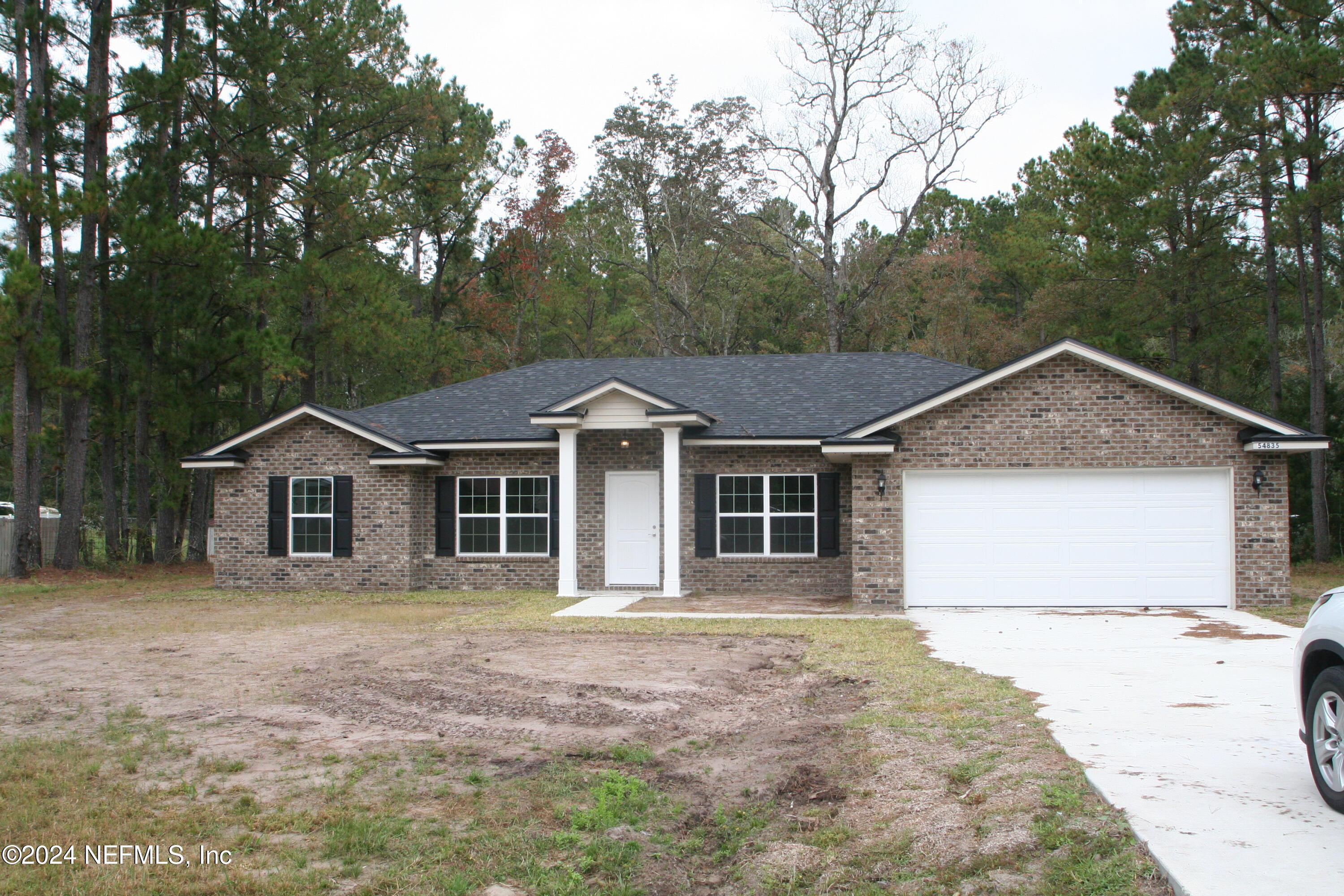 front view of a house with a yard