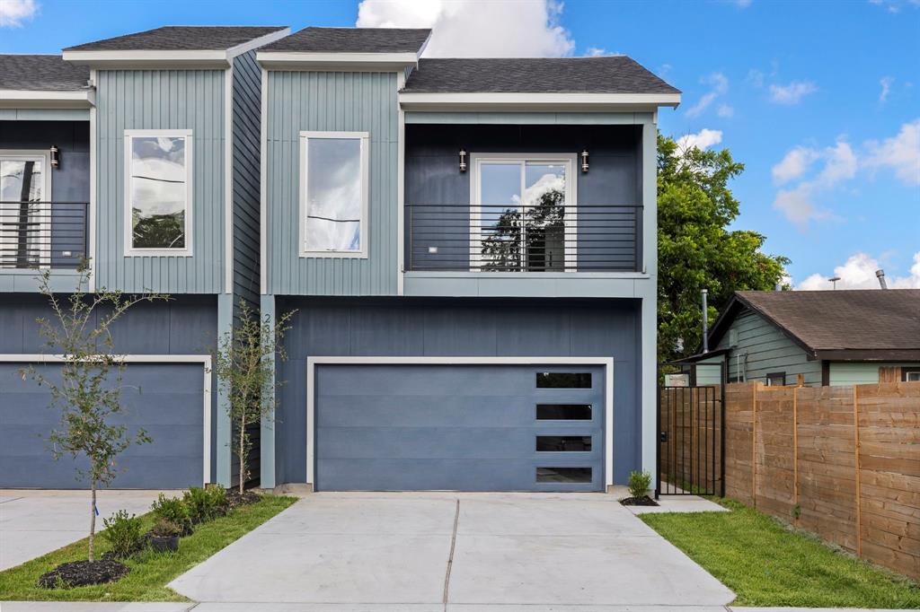 a front view of a house with garage