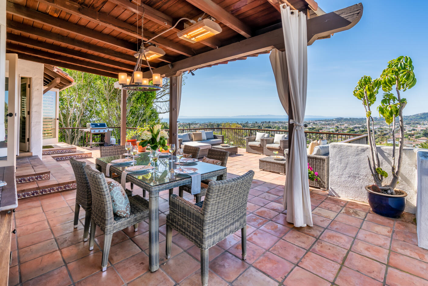 a view of an outdoor dining space with furniture