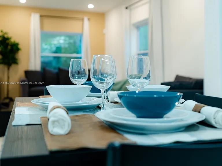 a view of a dining room with furniture window and outside view