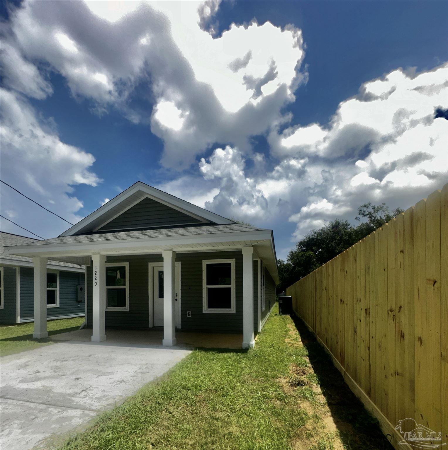 a view of a house with backyard