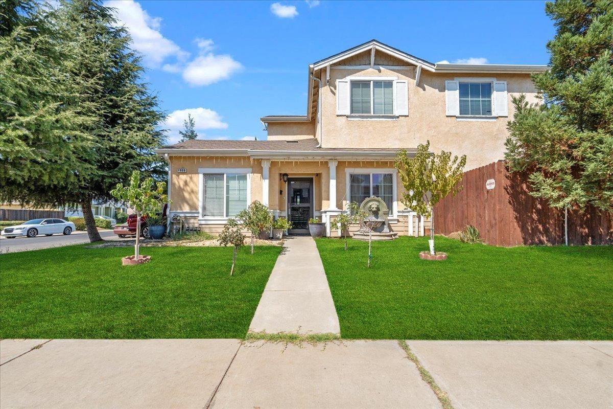 a front view of house with yard and green space