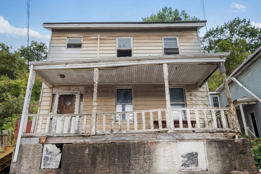 front view of a house with a balcony