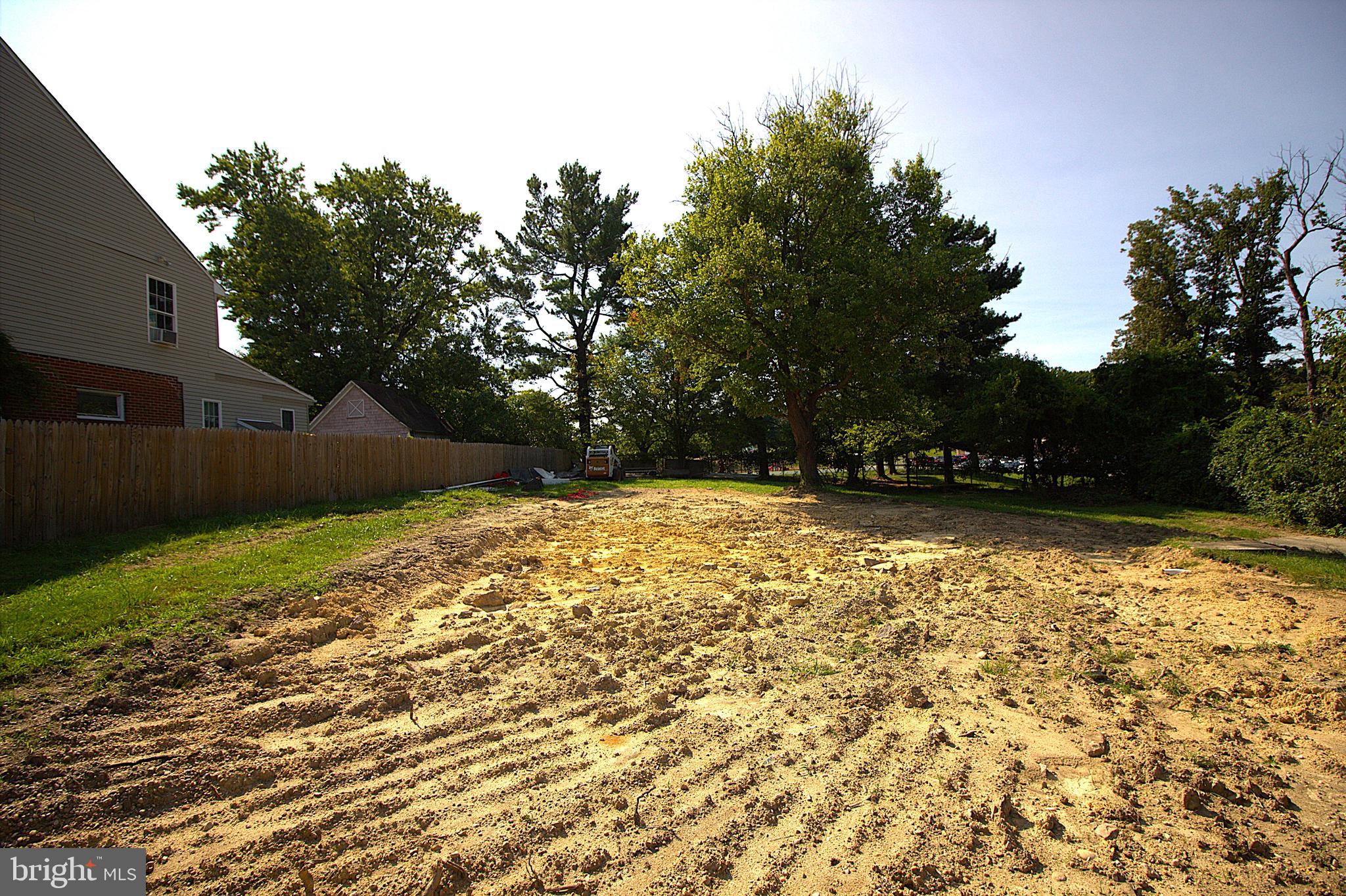 a view of house with backyard space