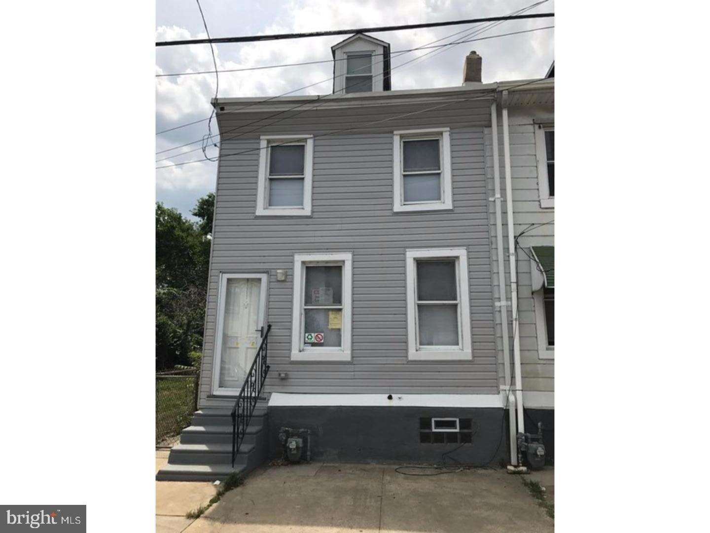 a front view of a house with parking