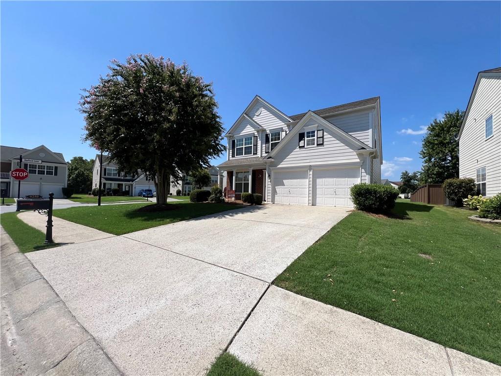 a front view of a house with a yard