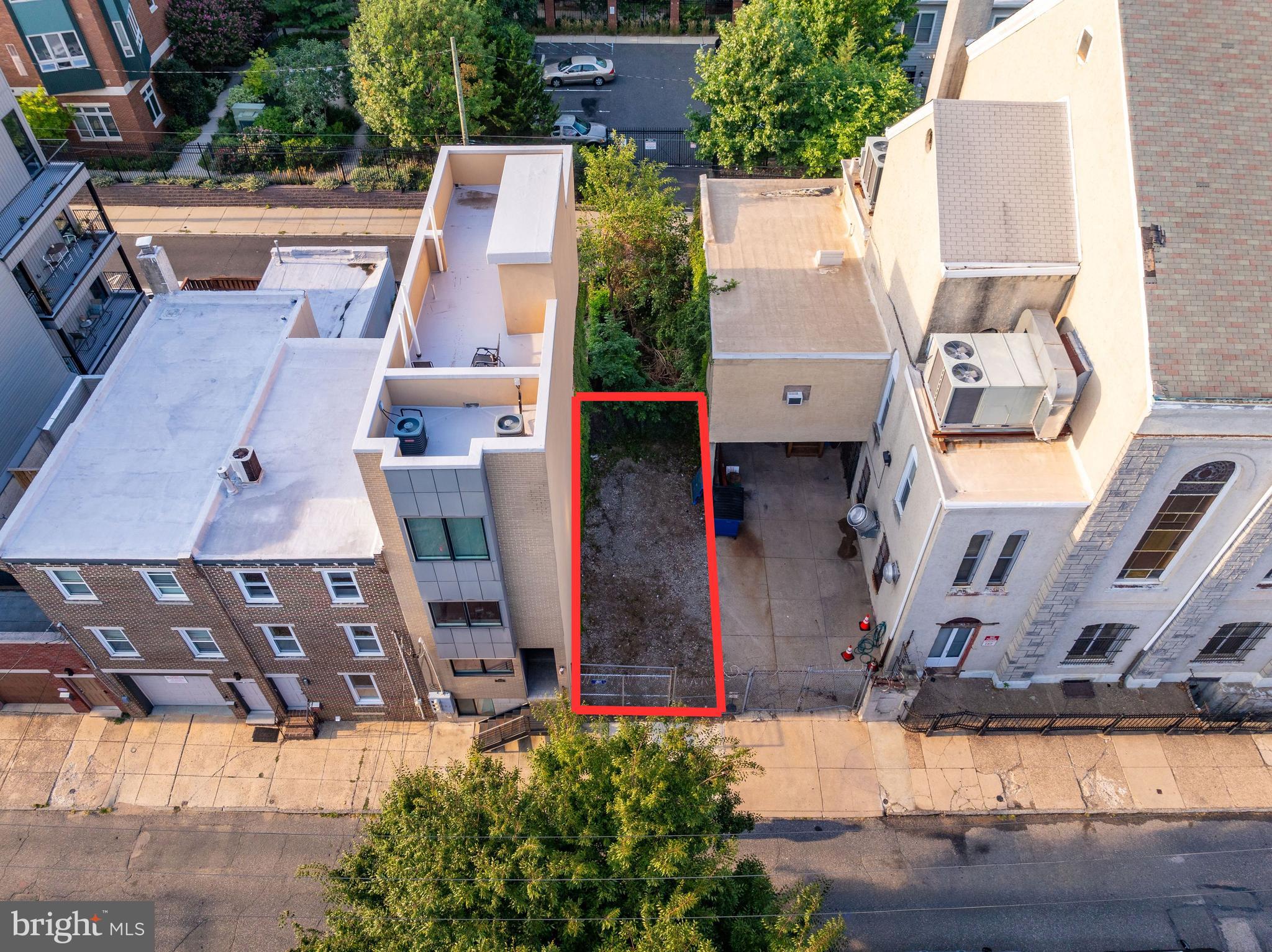 an aerial view of houses with outdoor space