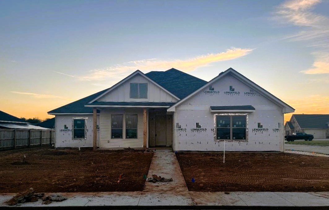 a front view of a house with yard